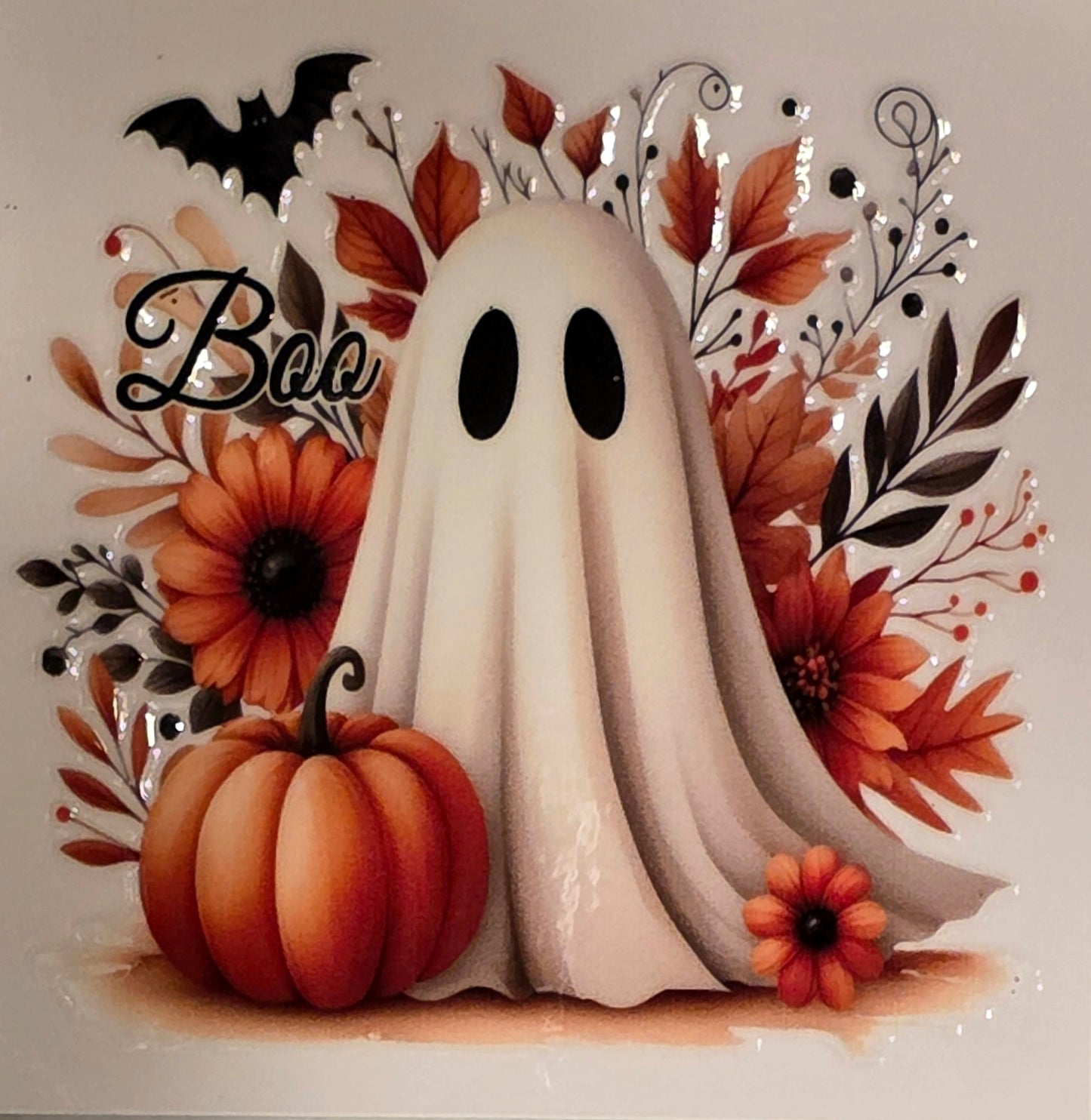 Halloween-themed card with ghost, pumpkin, and autumn leaves on a marble background