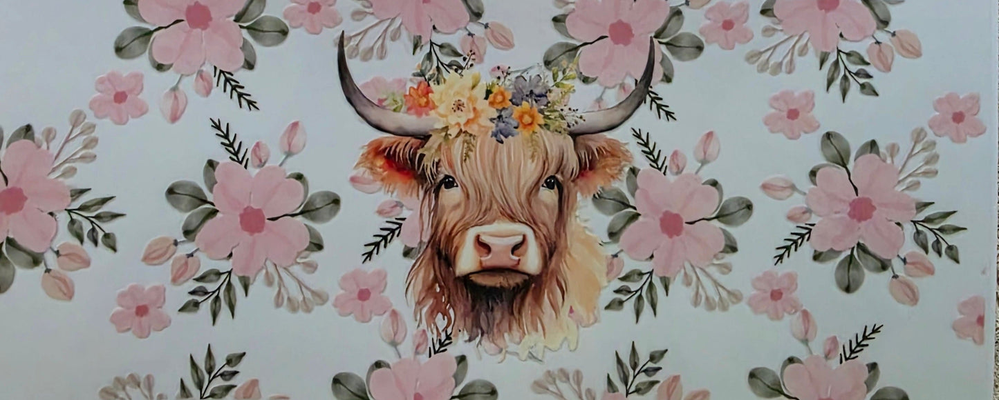 Sticker with a cow's face surrounded by floral patterns on a white background