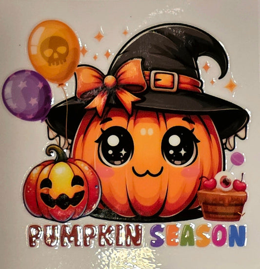 Cartoon pumpkin with witch hat and balloons on a marble background
