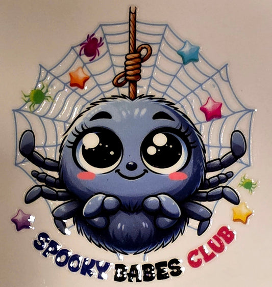 Cartoon spider with a web and stars on a beige background, featuring 'Spooky Babes Club' text.
