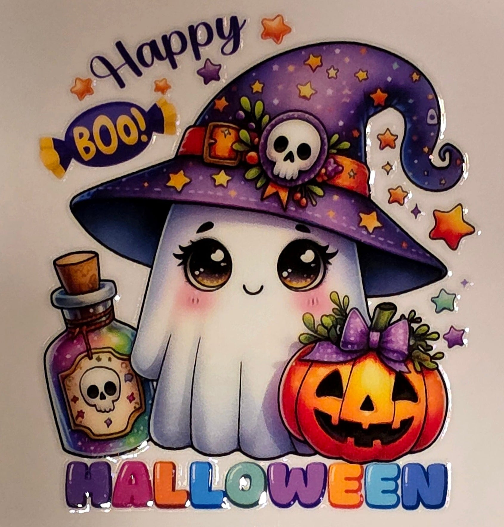 Halloween-themed card with a ghost, pumpkin, and potion bottle on a marble background