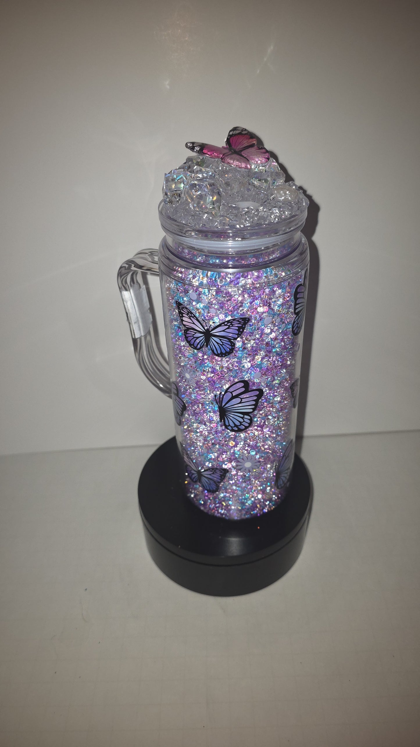 20 oz, acrylic with handle butterfly diamond filled and matching epoxy. Ice cube lid.