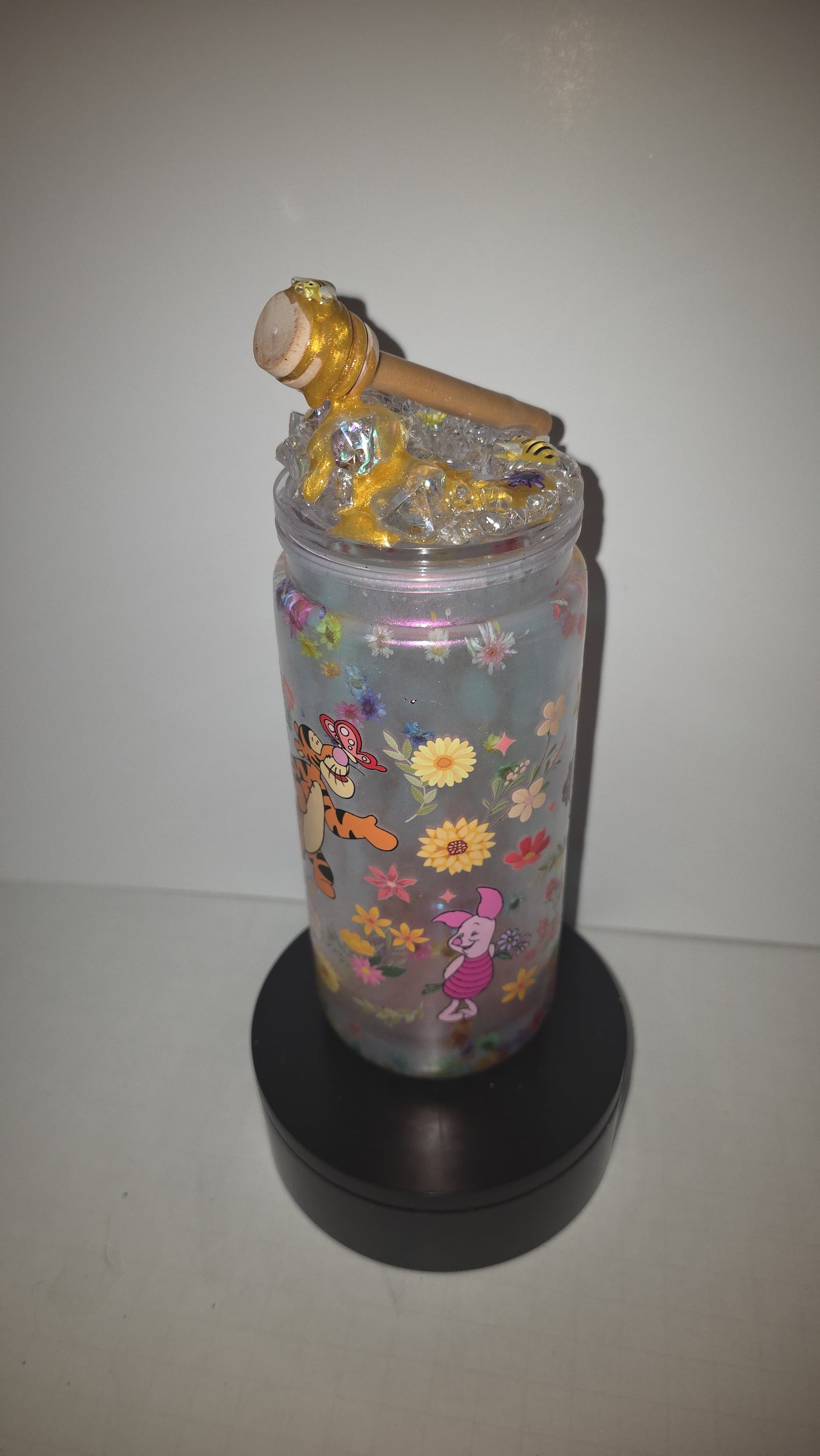 2o oz perlesscent Mica with floating dry flowers. Comes with matching, honey drip ice epoxy lid.